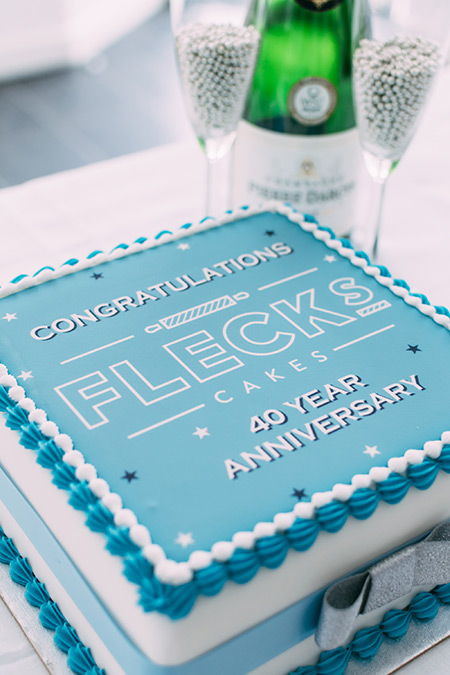 Lucky Yellow Corporate Cake With Gold Balls And Company Logo